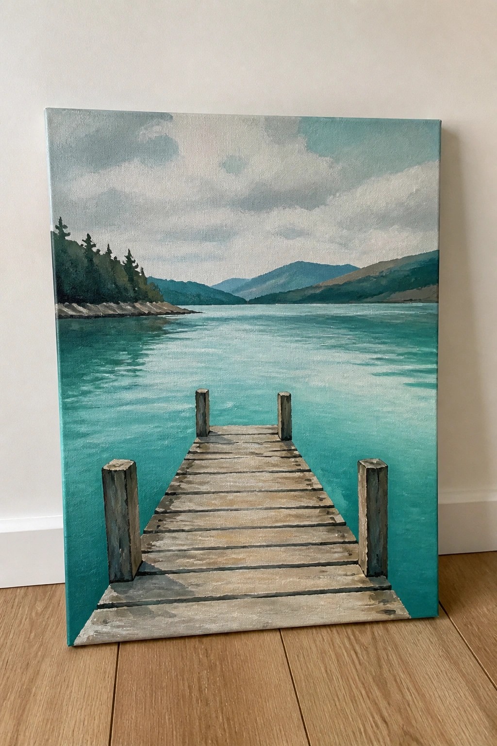 A painting of a wooden dock extending into a turquoise lake with mountains and trees in the background.