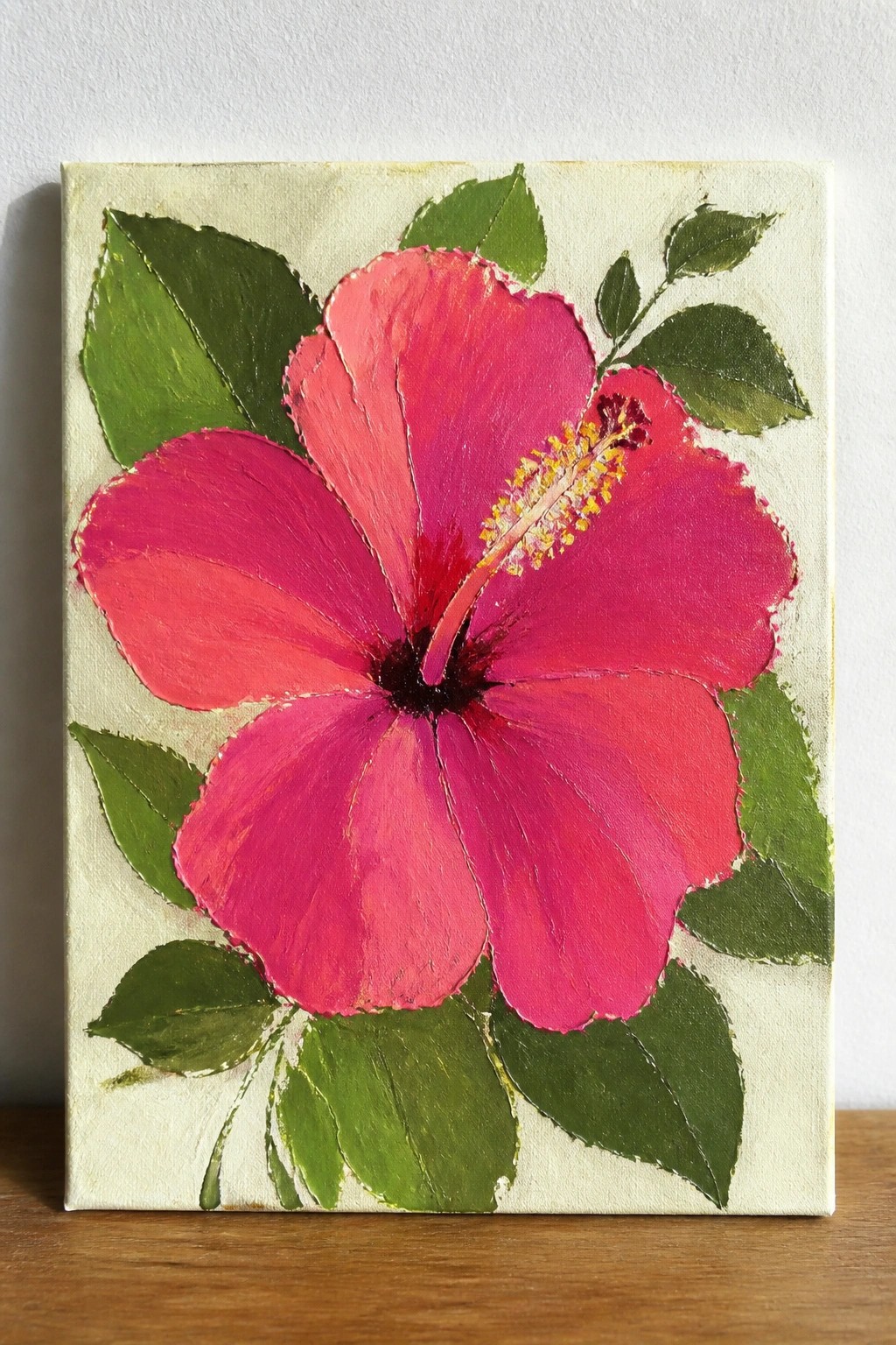 Vivid pink hibiscus flower painting with yellow stamens and green leaves on canvas