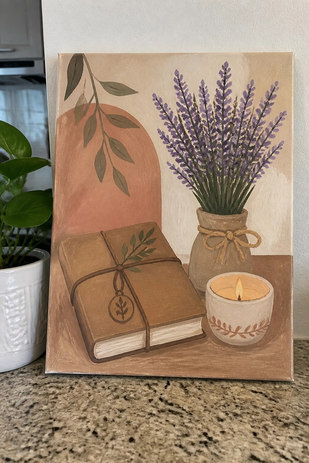 Rustic still life painting of bound book, lavender bouquet, and lit candle.