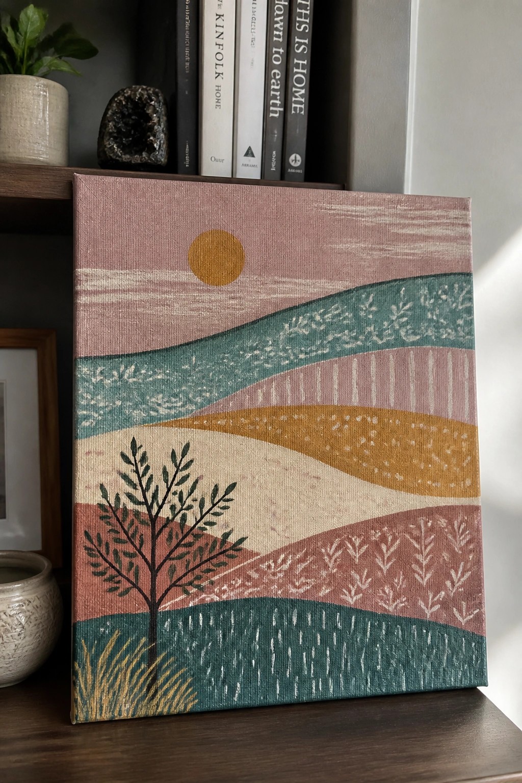 Abstract landscape painting with tree, sun, and wavy colorful hills on canvas