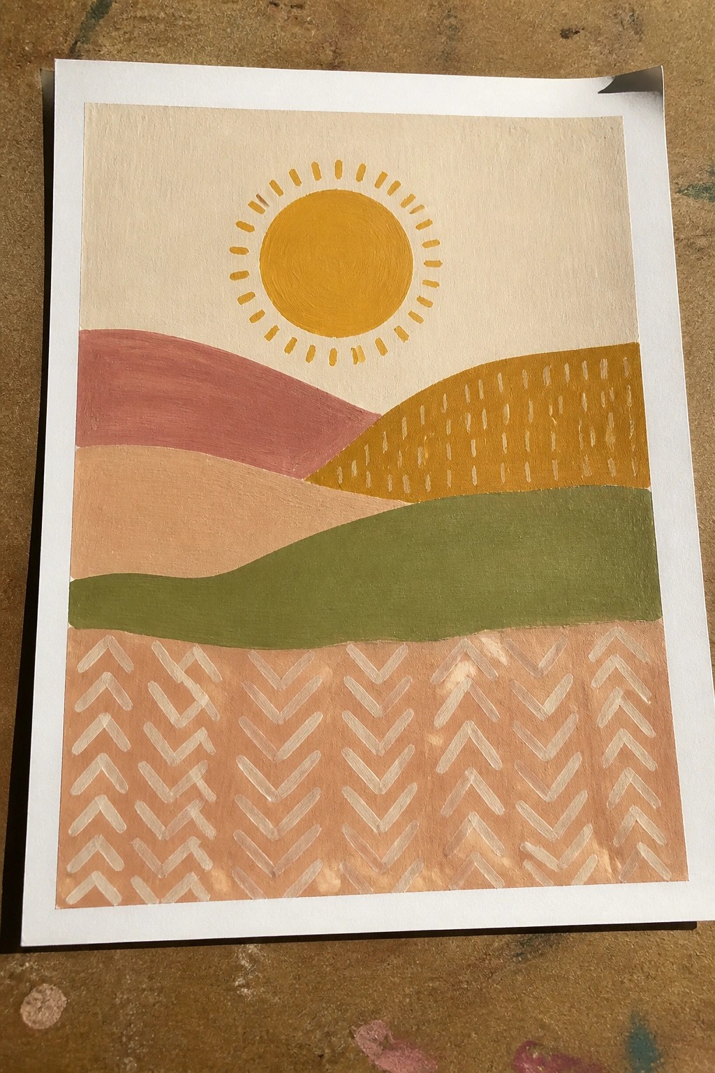Abstract painting of yellow sun over colorful rolling hills with chevron foreground.
