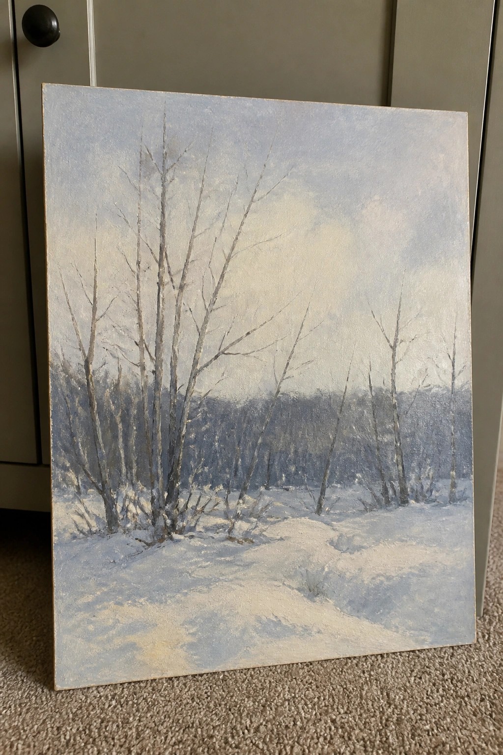 Snowy winter landscape painting with bare trees and soft blue-gray tones