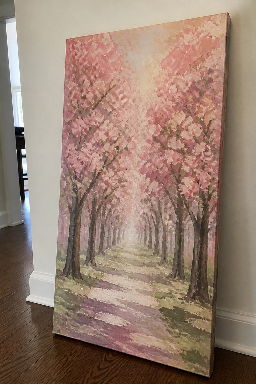 Large impressionistic painting of pink cherry trees lining a path