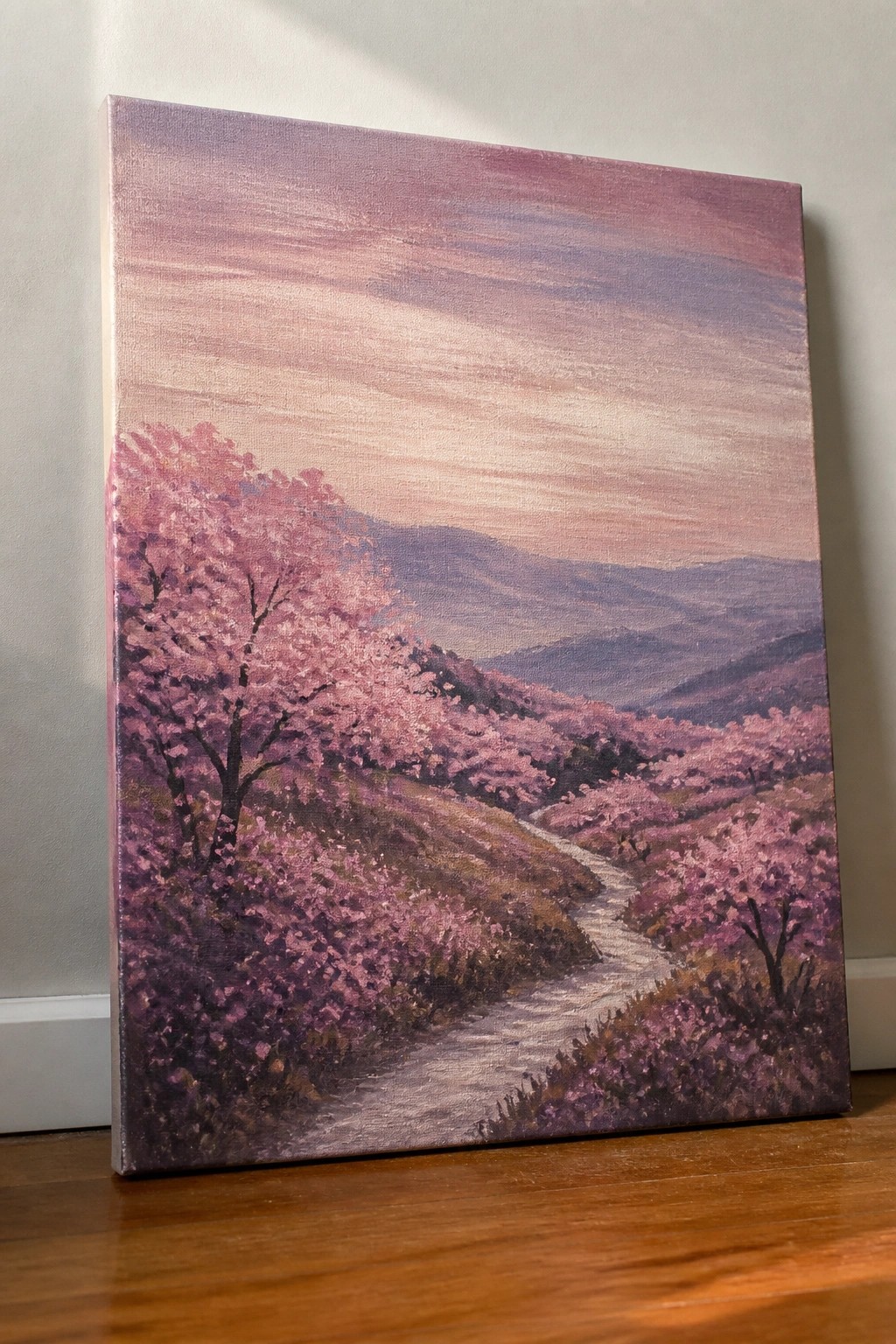 Painting of winding path through pink cherry blossoms on hills under purple sky