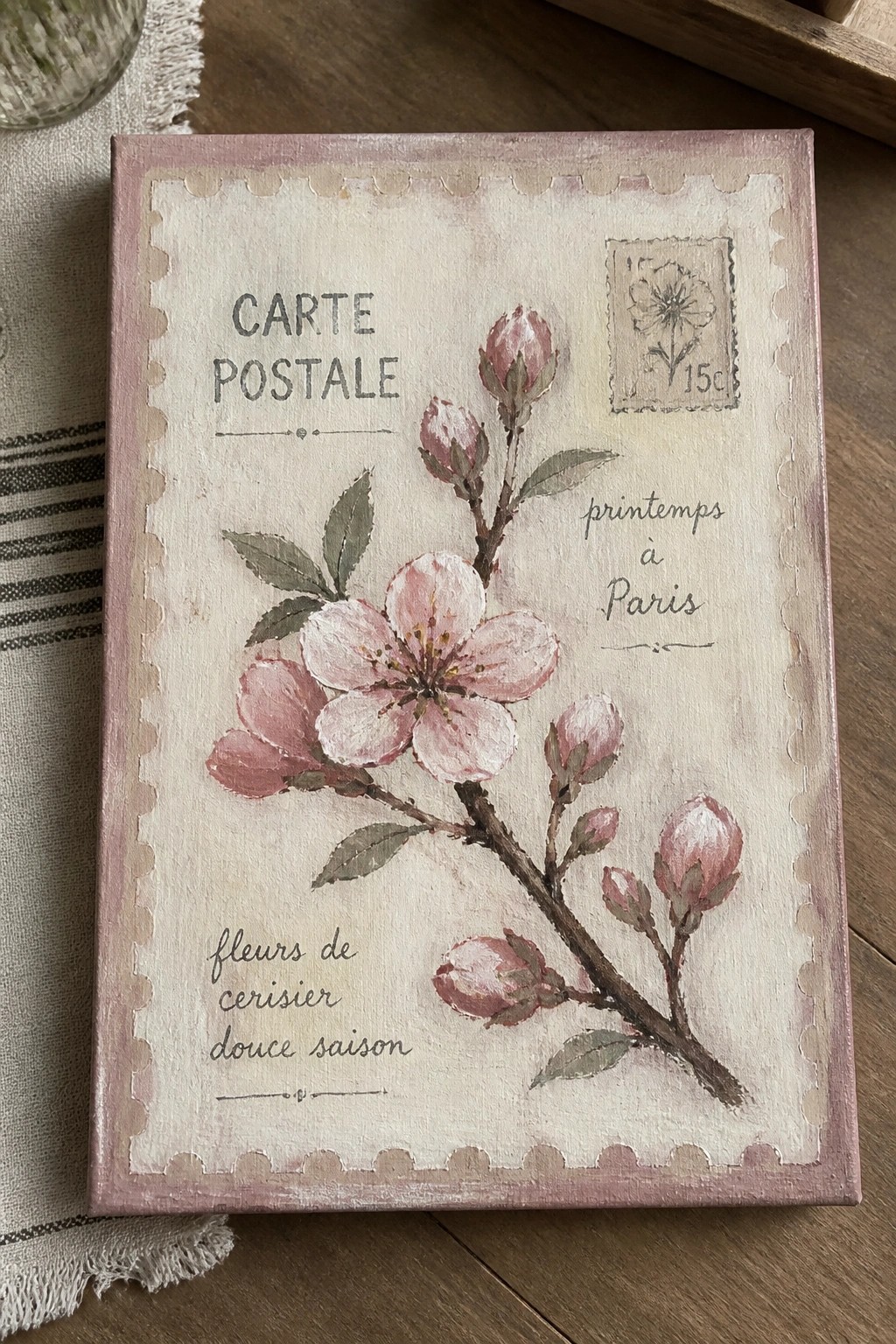 Vintage postcard-style painting of pink cherry blossoms with French text and stamp