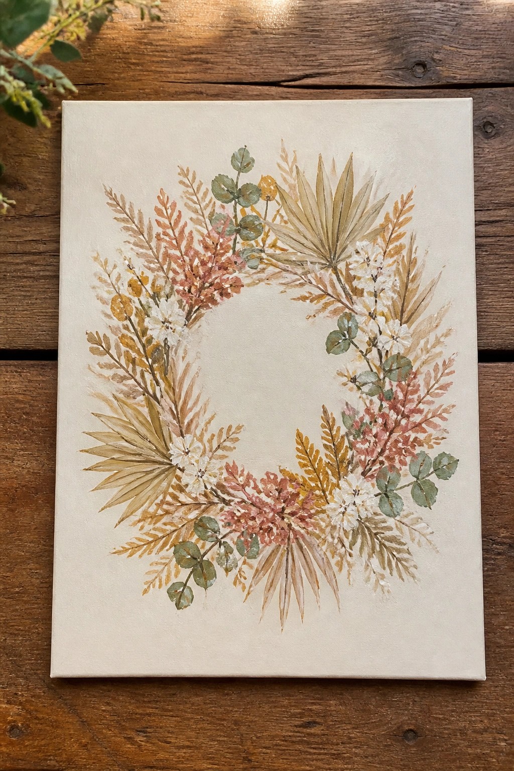 Watercolor floral wreath with autumn leaves and white flowers on canvas