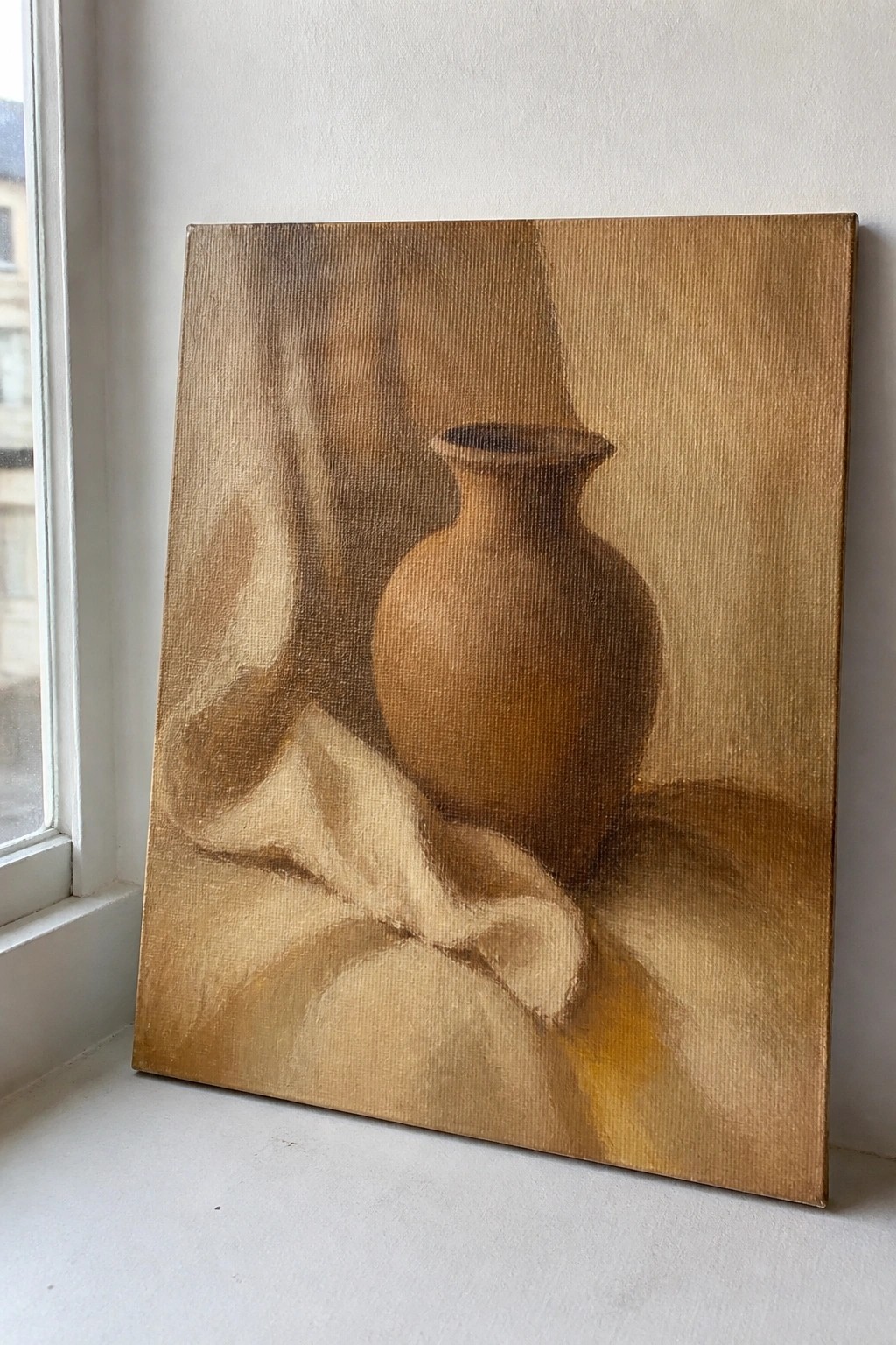 Earth-toned still life painting of a brown vase on draped fabric by window