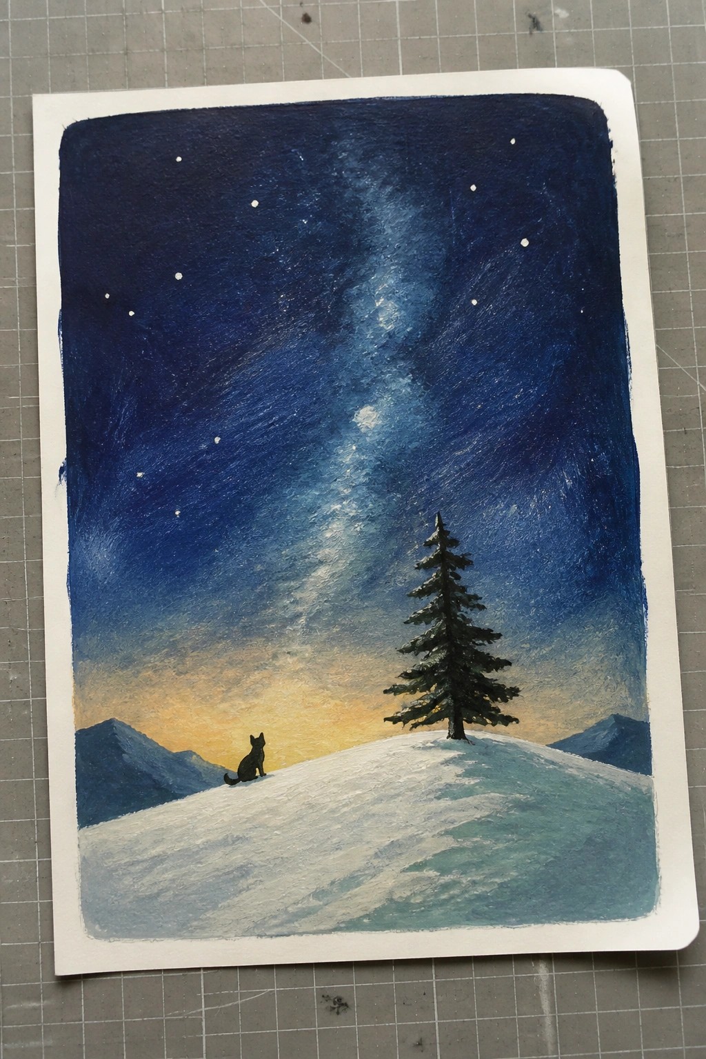 Watercolor of starry night sky with Milky Way over snowy hill, pine tree, and black cat