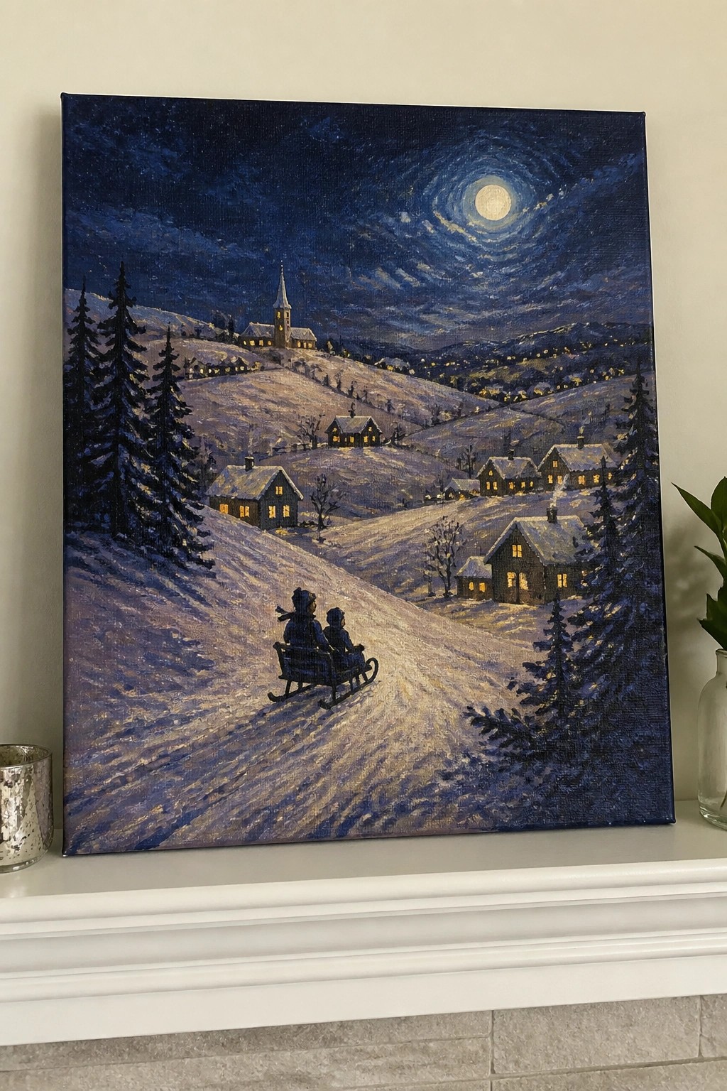 Children sledding down snowy hill at night toward moonlit village with glowing windows
