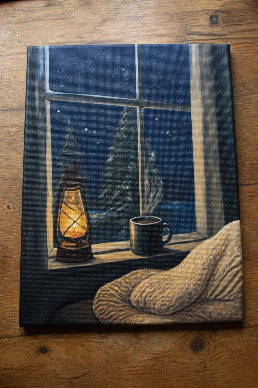 Realistic painting of glowing lantern and coffee mug beside knitted blanket on snowy night windowsill