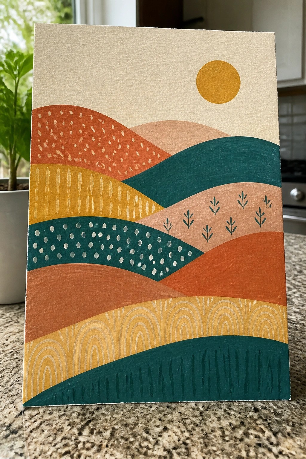 Abstract painting of layered hills in orange, teal, and yellow with a golden sun.