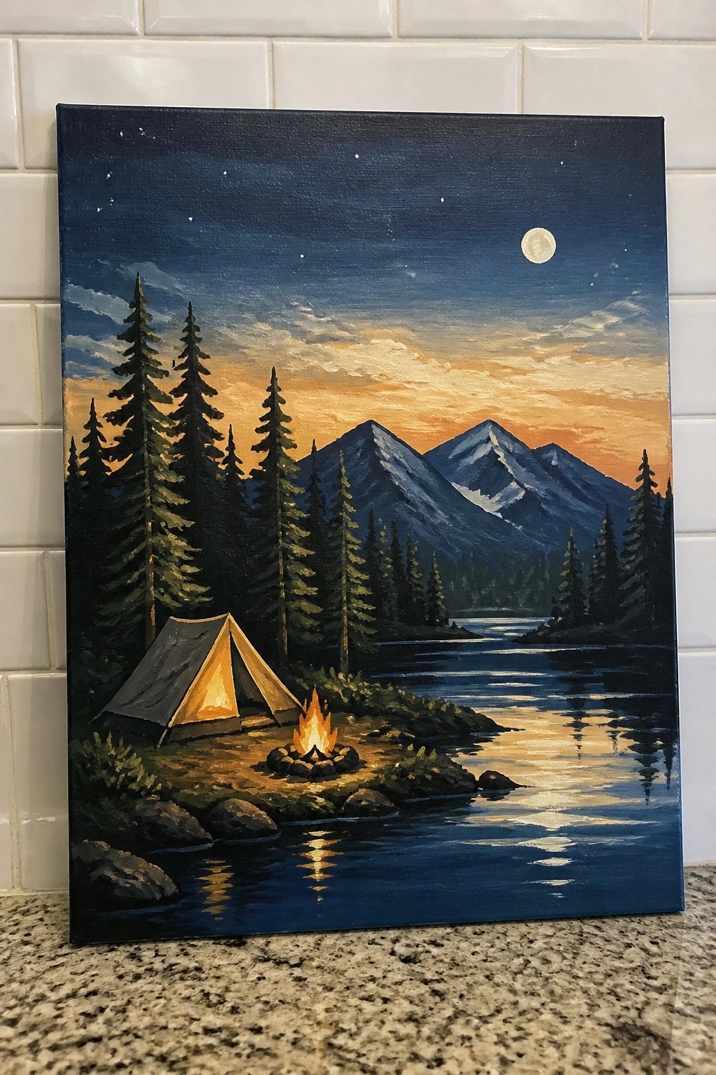 Glowing tent and campfire by a moonlit lake with pine trees and snowy mountains.