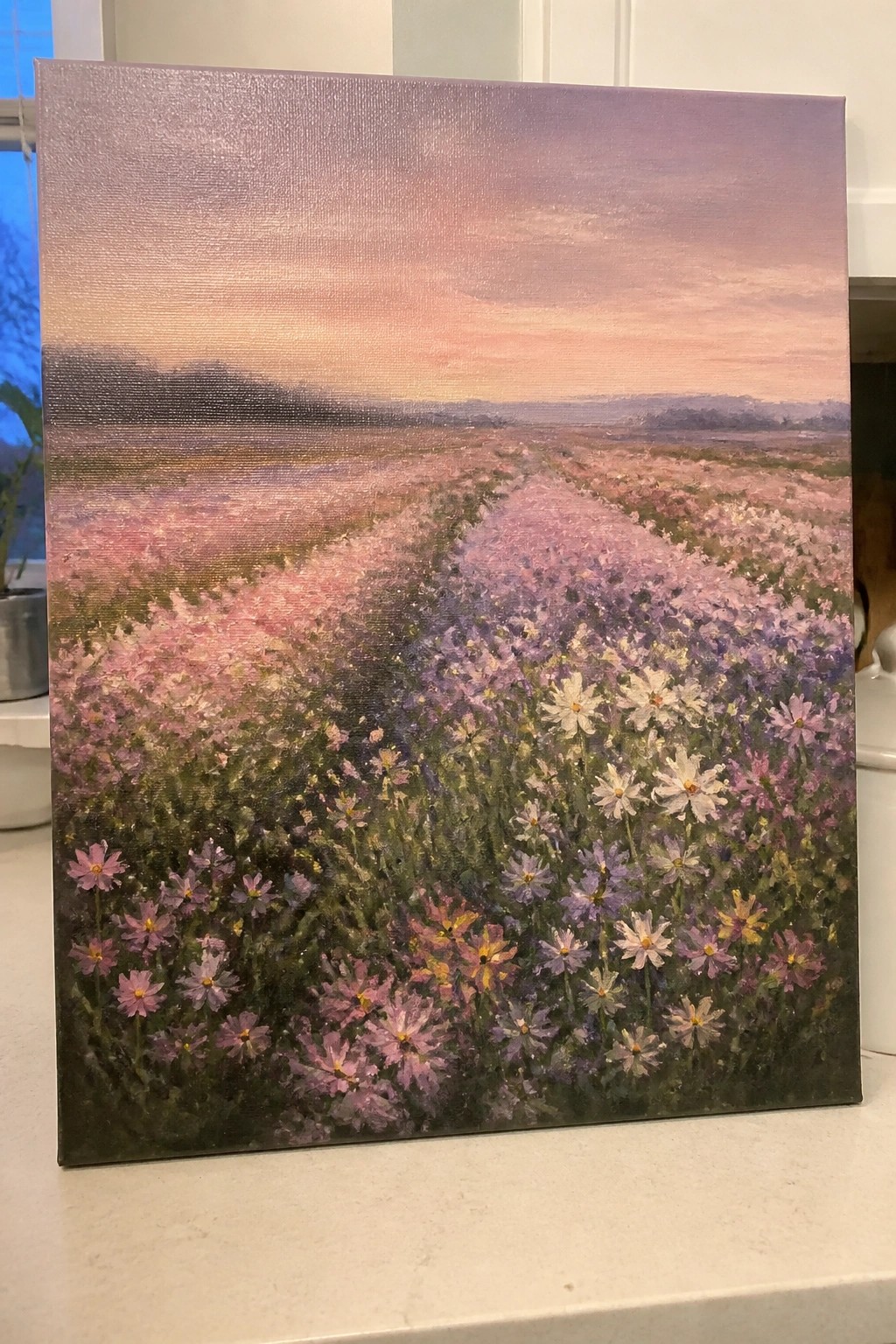 Oil painting of pink-purple wildflowers along a winding path at sunset