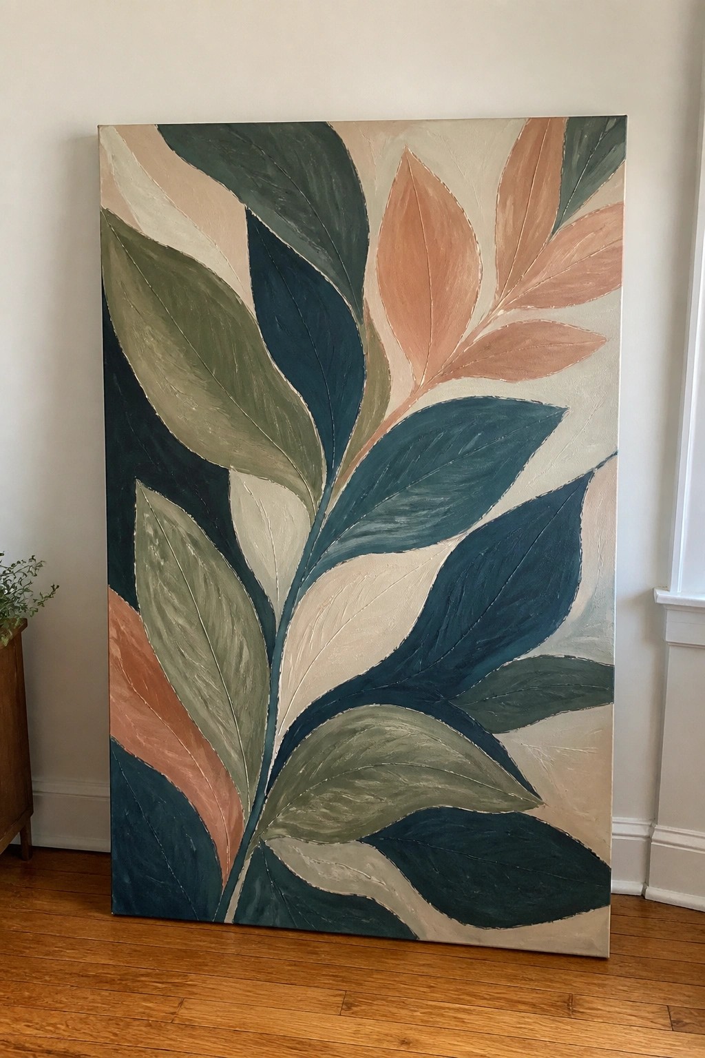 Abstract painting of overlapping leaves in teal, green, coral, and beige tones on canvas