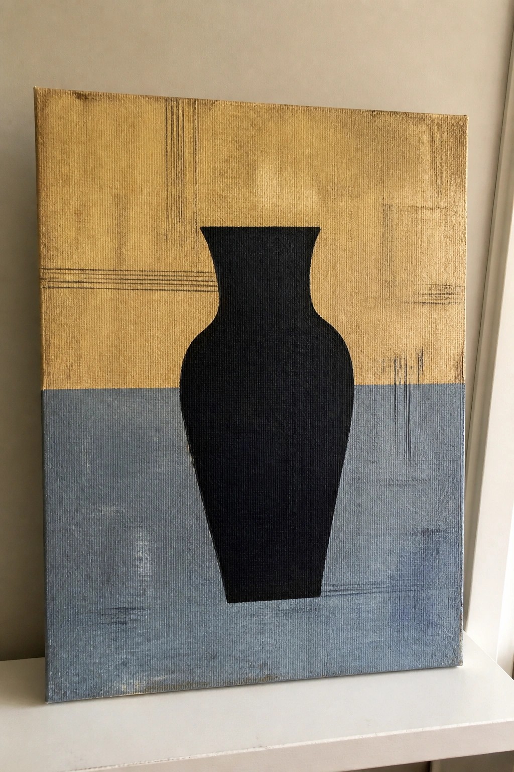 Abstract painting of black vase silhouette on textured gold and blue background.