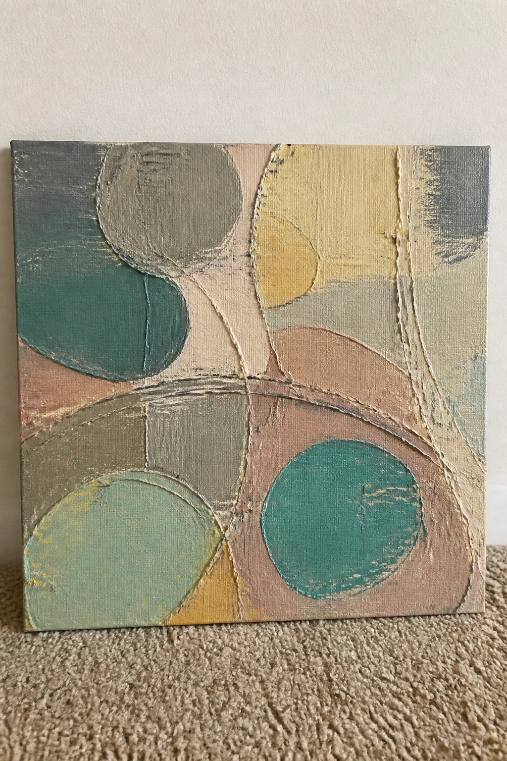 Abstract canvas with overlapping circles and curves in teal, green, yellow, and pink.