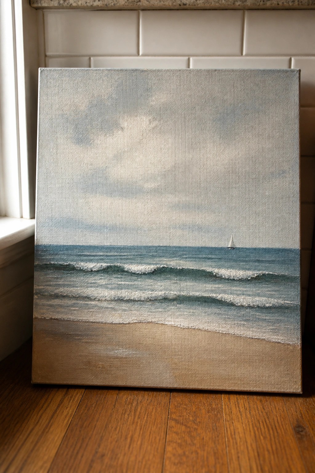 Realistic seascape painting on canvas depicting ocean waves, sandy beach, and distant sailboat.