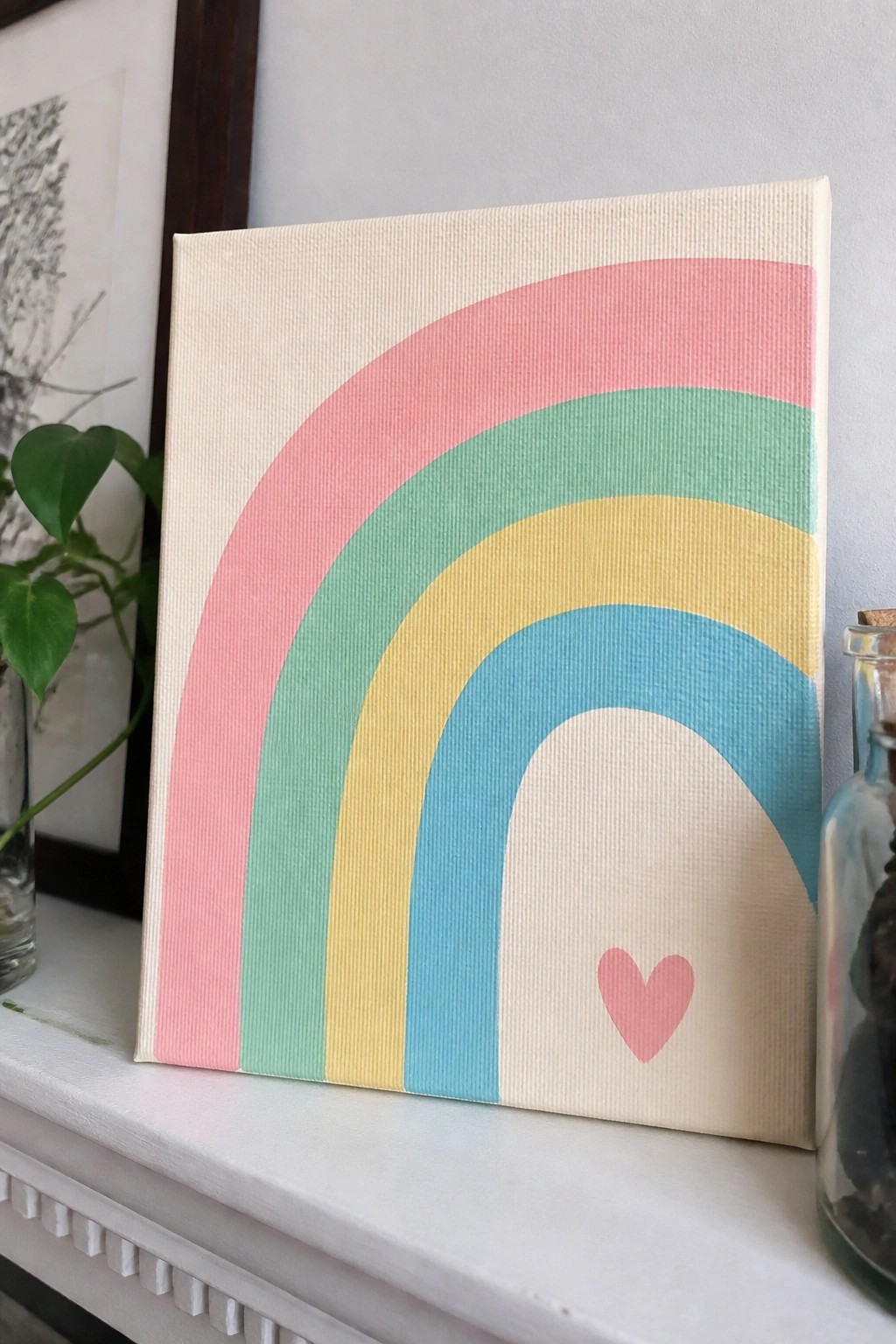 Pastel rainbow on canvas with pink, green, yellow, blue arches and heart