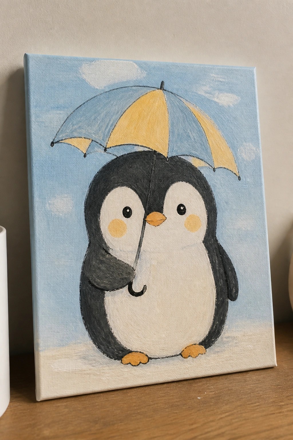 Cute cartoon penguin holding blue-yellow umbrella against cloudy sky on canvas.