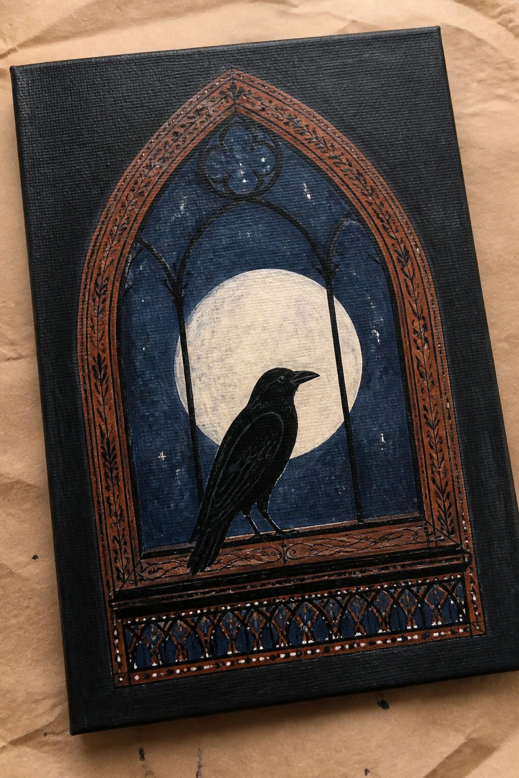 A black raven stands on the ledge of an ornate gothic arched window against a starry night sky with a full moon visible behind it.
