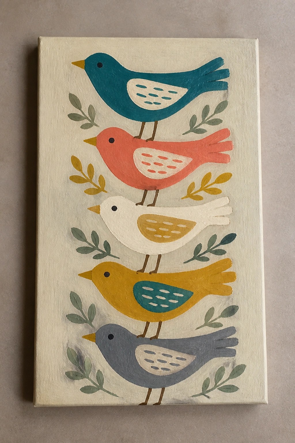 Five stacked colorful birds in teal, coral, white, yellow, and gray with decorative leaves.