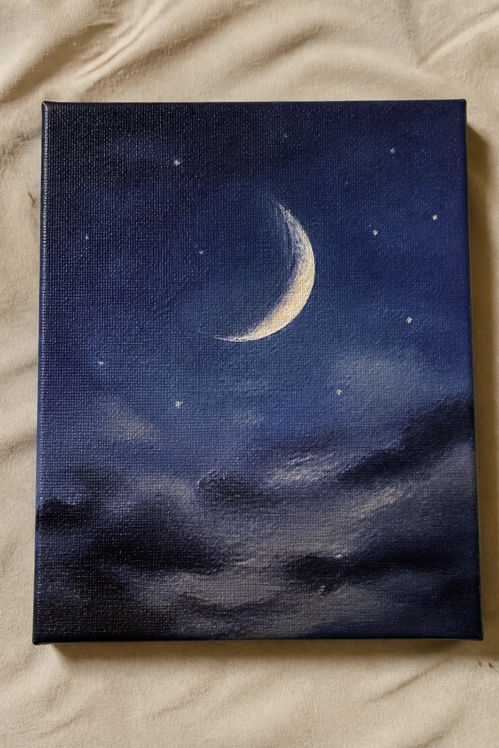 Crescent moon painting in dark blue sky with stars and clouds on canvas