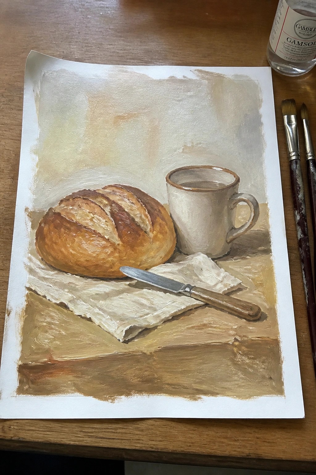 Oil painting still life with bread loaf, white mug, knife on cloth