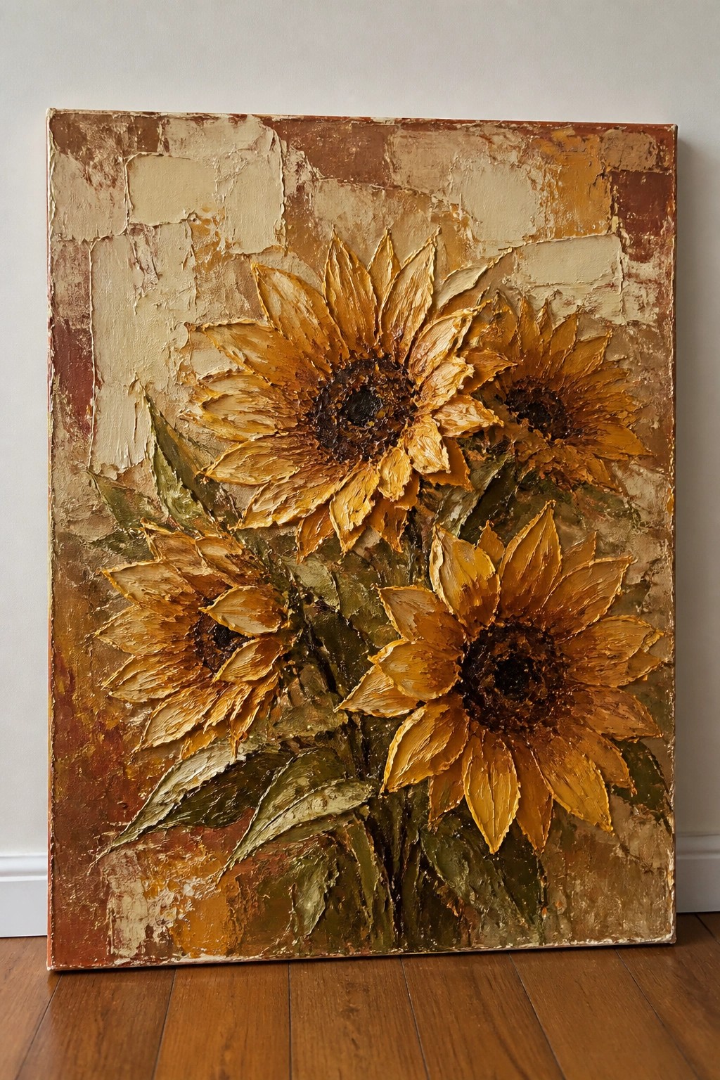 Impasto oil painting of four golden sunflowers with green leaves on earthy textured background