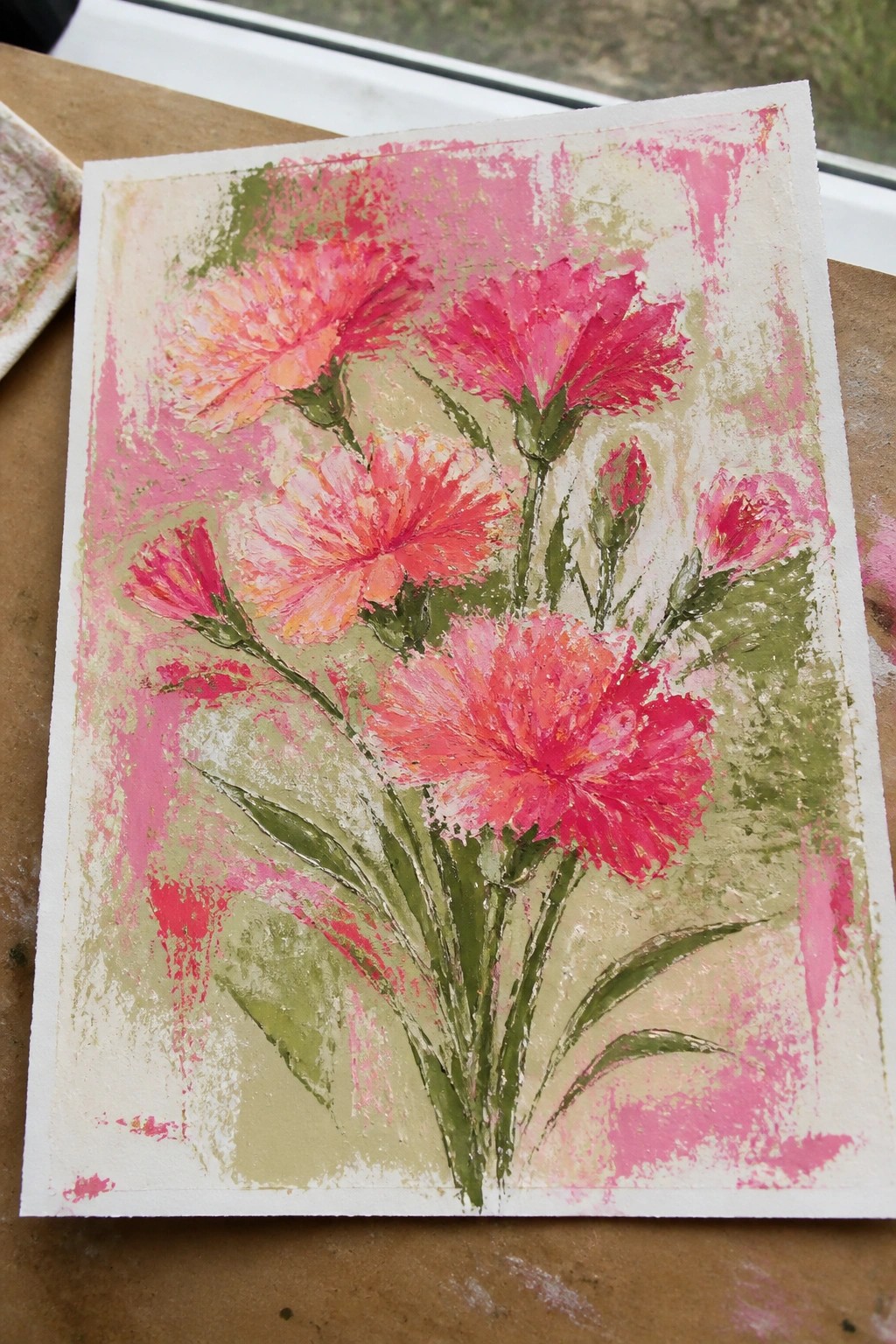 Vibrant pink and orange watercolor flowers with green stems on textured paper.
