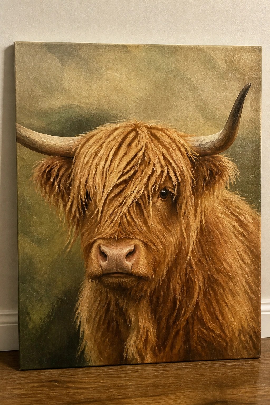 Realistic painting of shaggy brown Highland cow with large horns on canvas