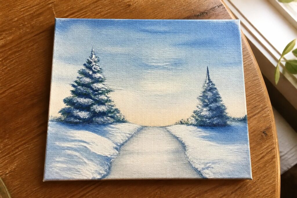 Snowy winding road flanked by snow-covered pine trees under blue and yellow sky on canvas