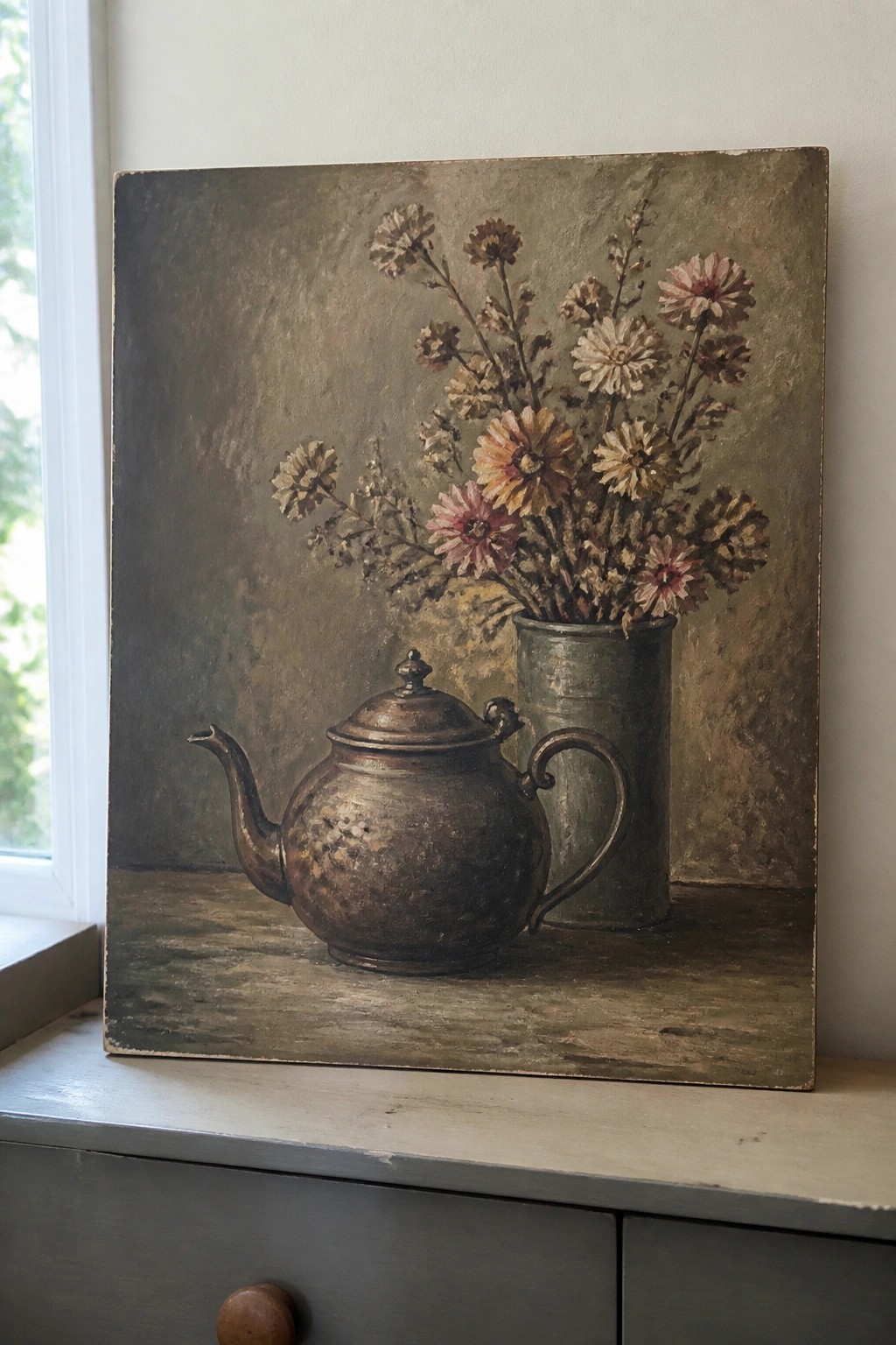 Worn metal teapot beside a vase of dried flowers in a muted still life painting.