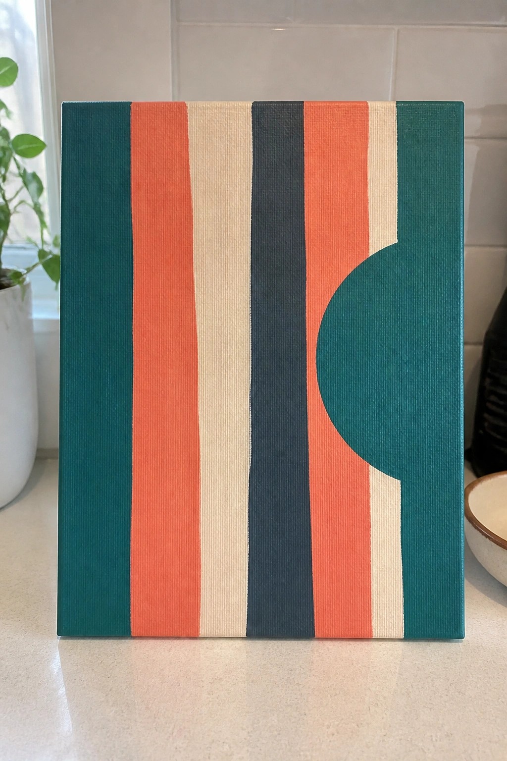 Abstract canvas with vertical teal, orange, beige, and navy stripes plus a teal circle