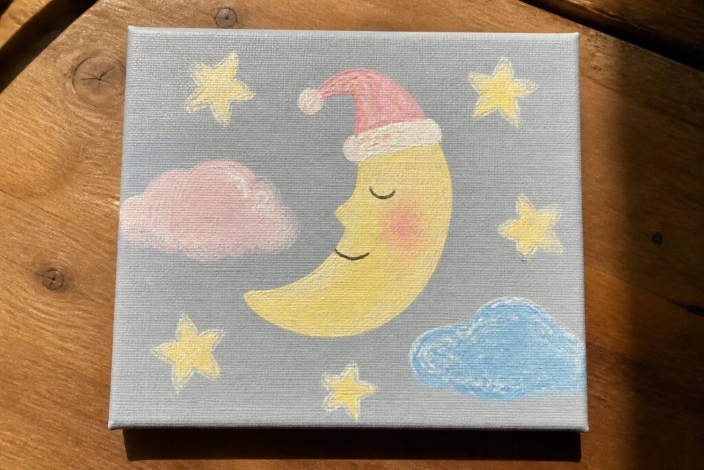 Cute smiling crescent moon in pink Santa hat with yellow stars and pink clouds on canvas