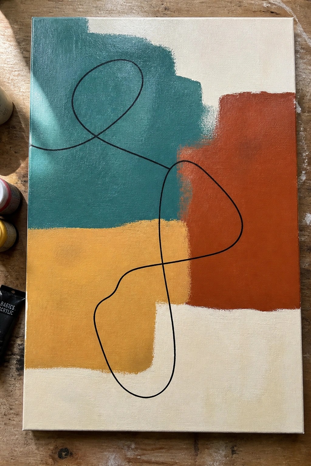 Abstract painting with teal, orange, yellow blocks and continuous black looped line on wood.