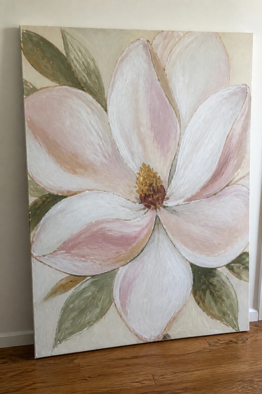 Large canvas painting of a white-pink magnolia flower with green leaves and gold accents