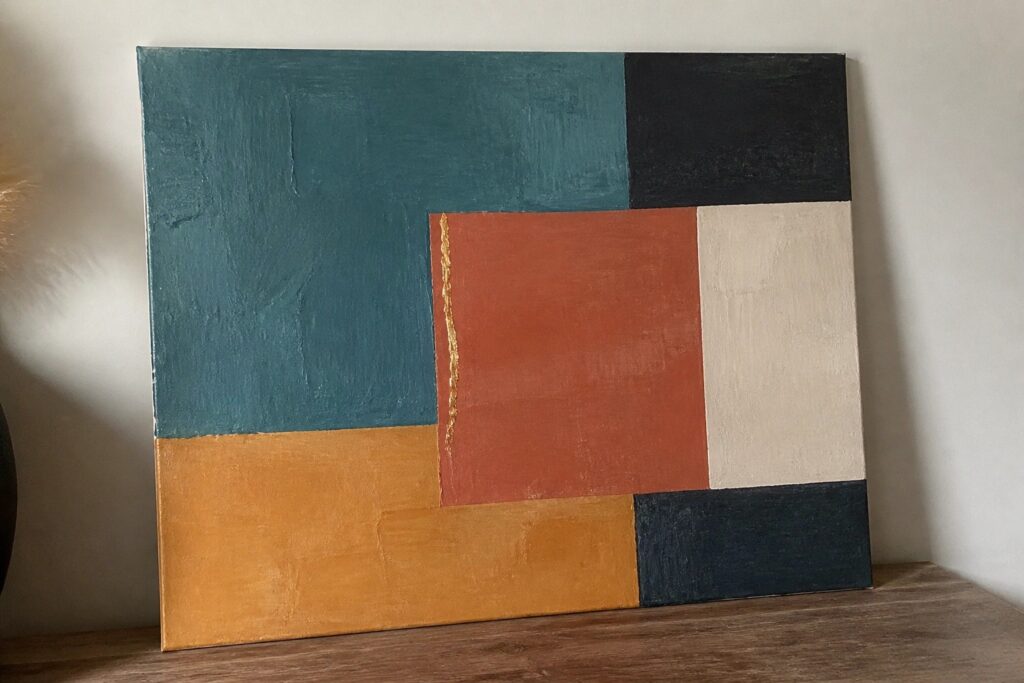 23 Modern Acrylic Painting Ideas To Instantly Elevate Your Space Abstract geometric painting with teal orange beige blocks and gold line on wooden shelf