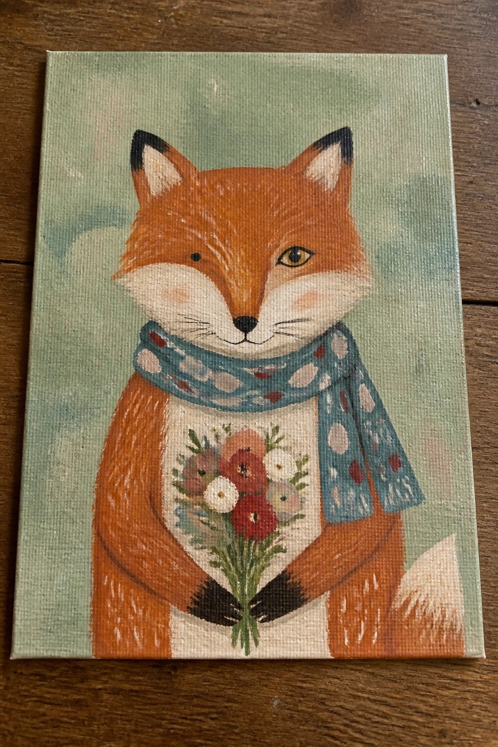 Cute fox in blue polka-dot scarf holds colorful flower bouquet on canvas