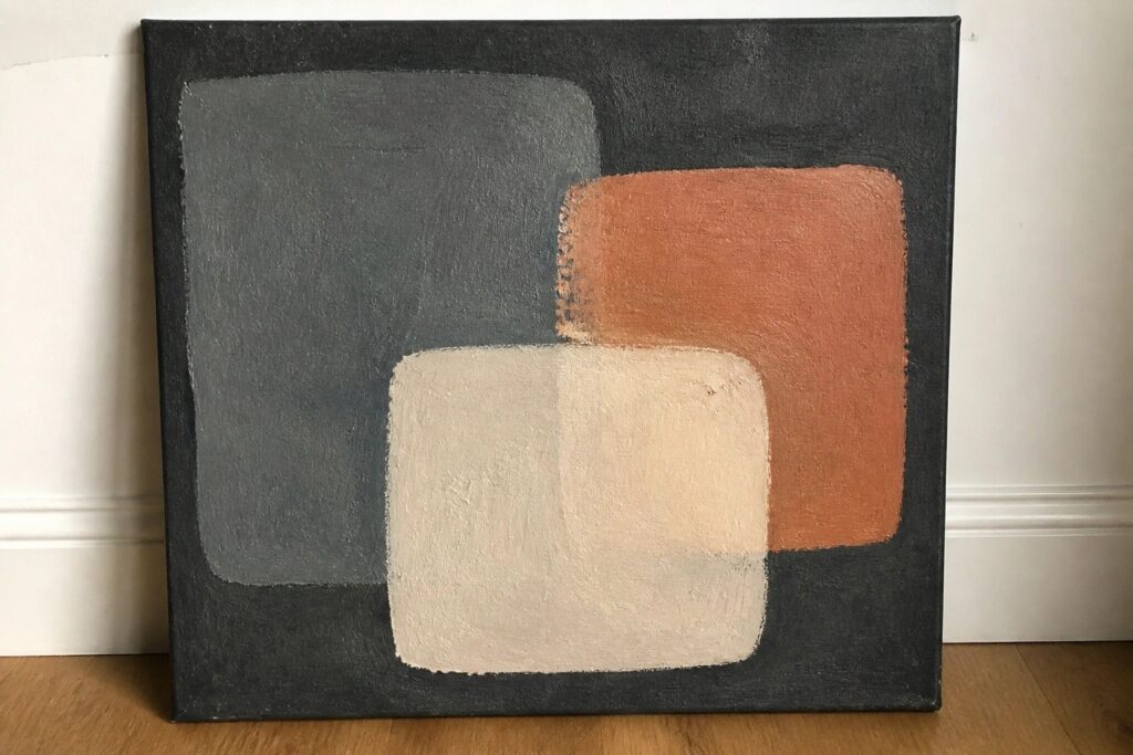 Abstract painting with overlapping rounded shapes in muted blue, beige, and terracotta on dark background.