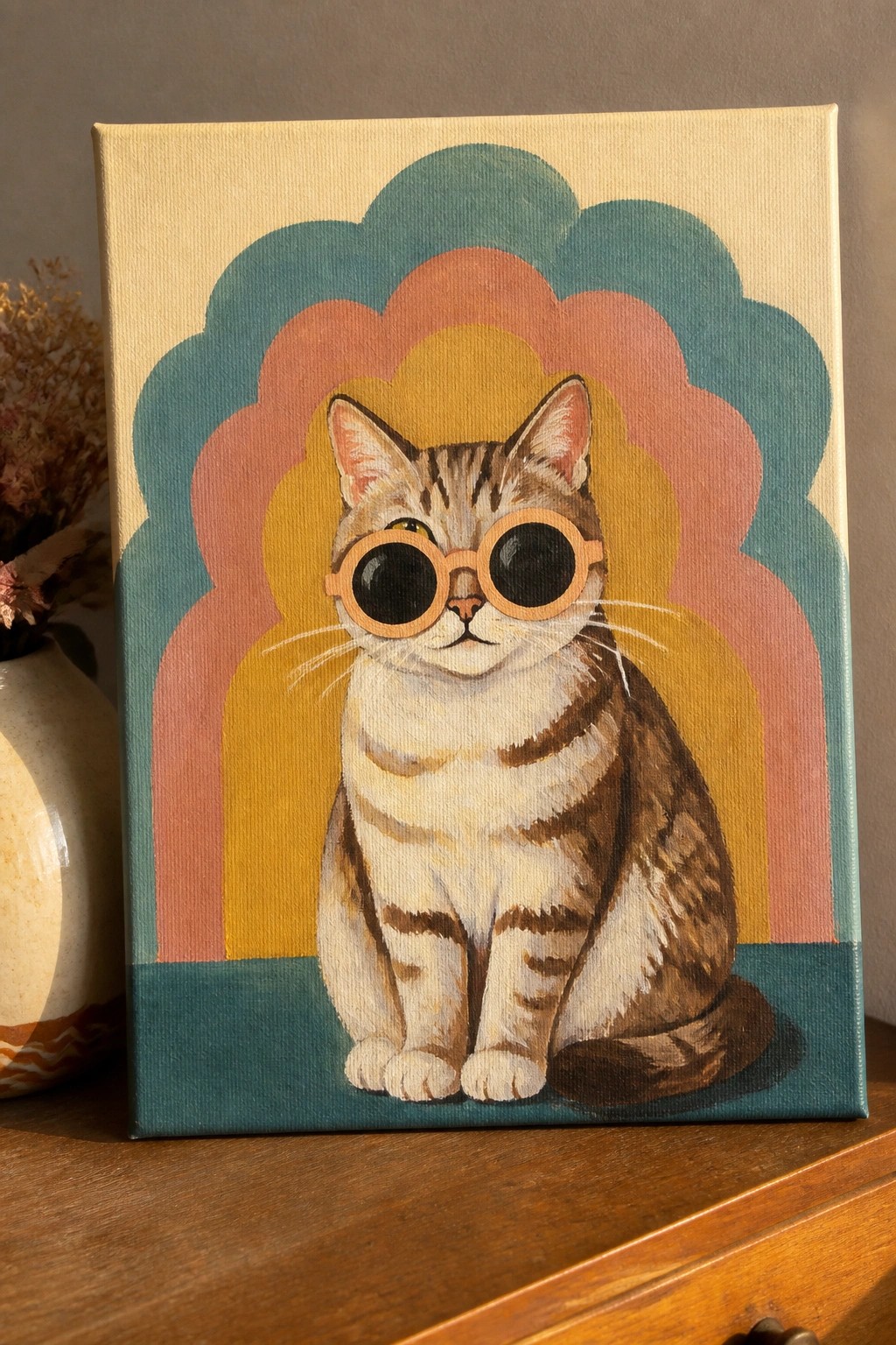 Tabby cat in round sunglasses before colorful scalloped retro arches on canvas