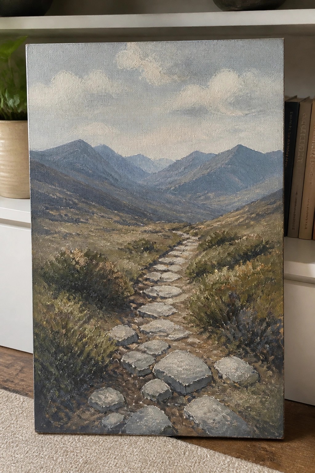 Oil painting of stone path winding through green hills toward blue mountains