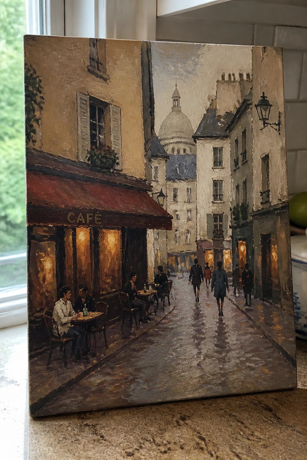 Impressionistic painting of rainy Paris café street with seated patrons, pedestrians, and distant dome.