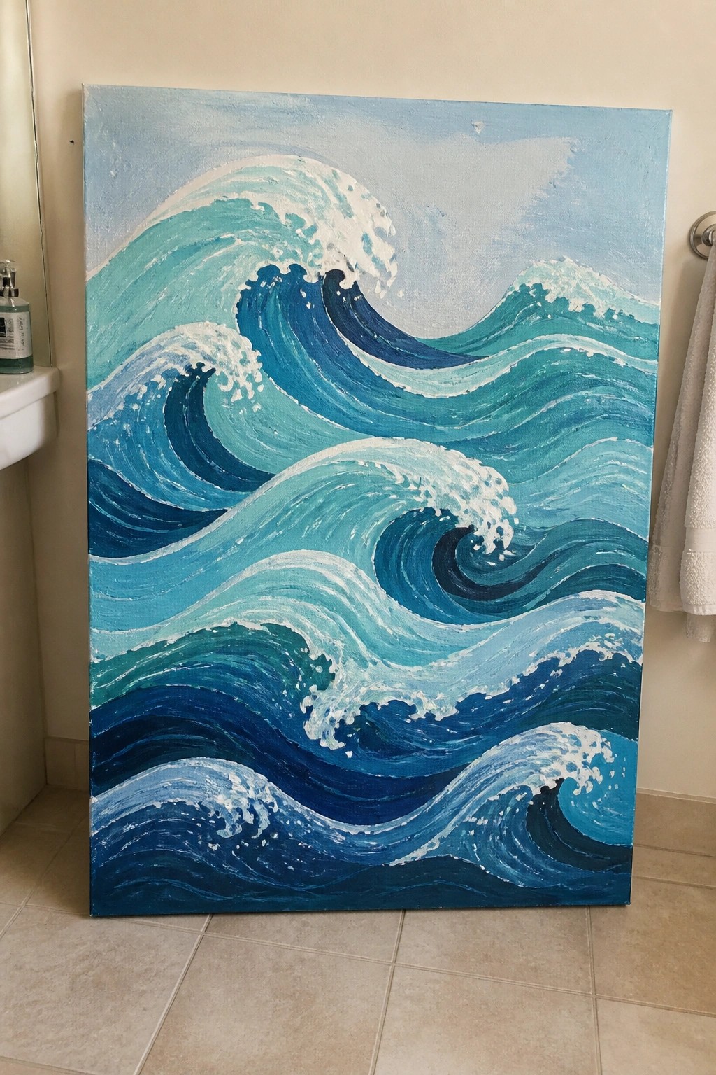 Large canvas painting of curling blue ocean waves with white foam crests