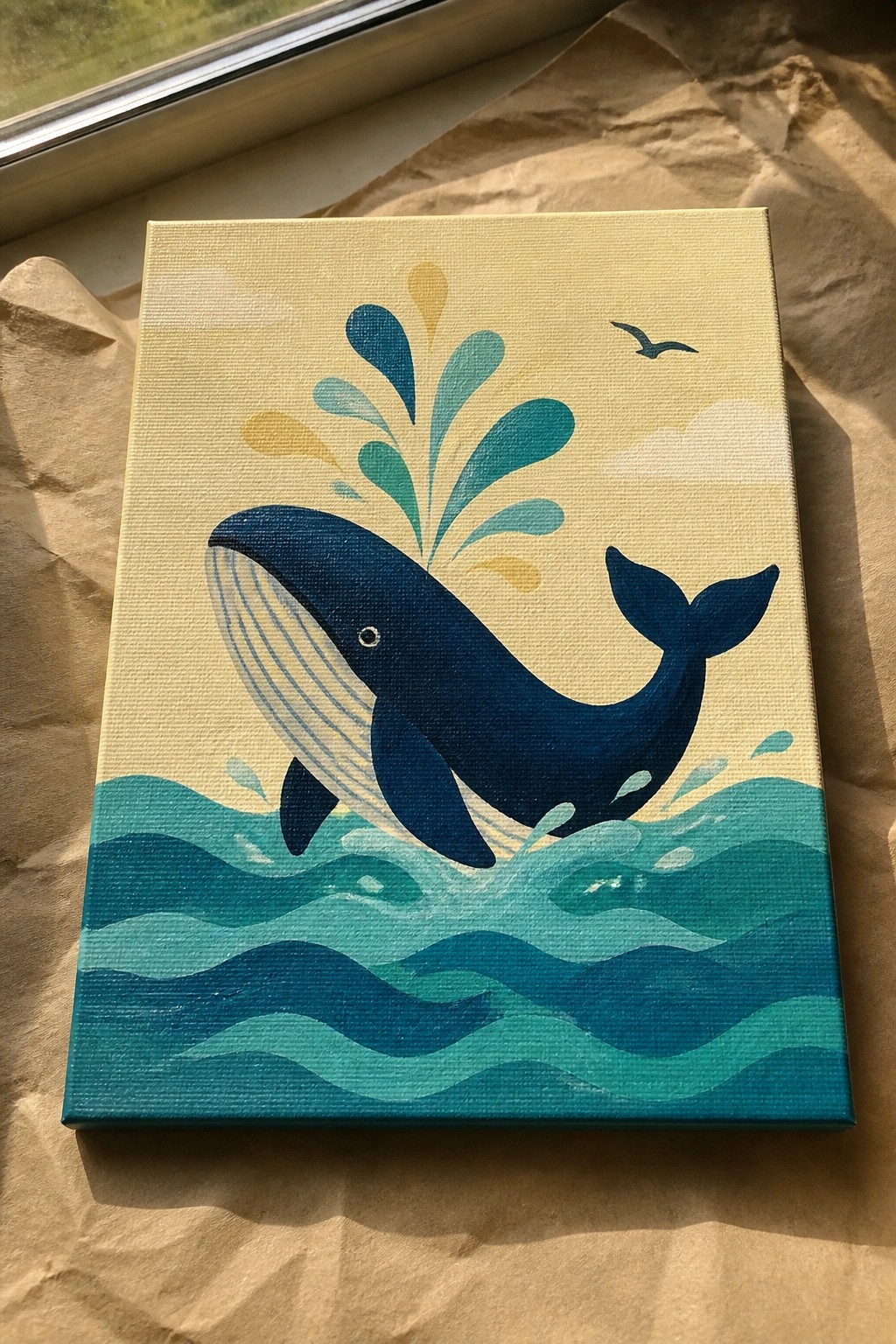 Stylized canvas painting of blue whale breaching teal waves under yellow sky with splashes.