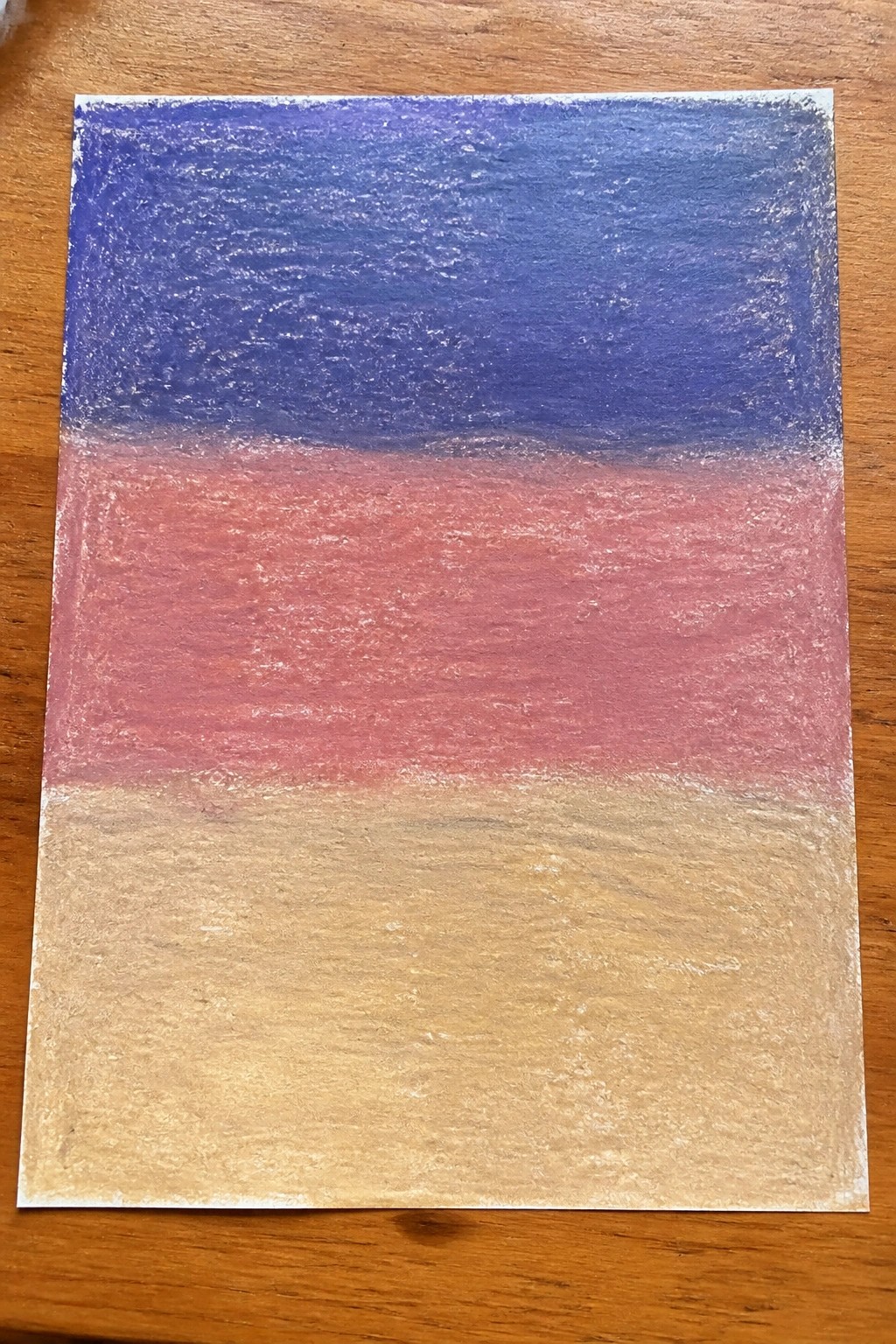 Abstract pastel artwork with blue, red, and beige horizontal bands on wood