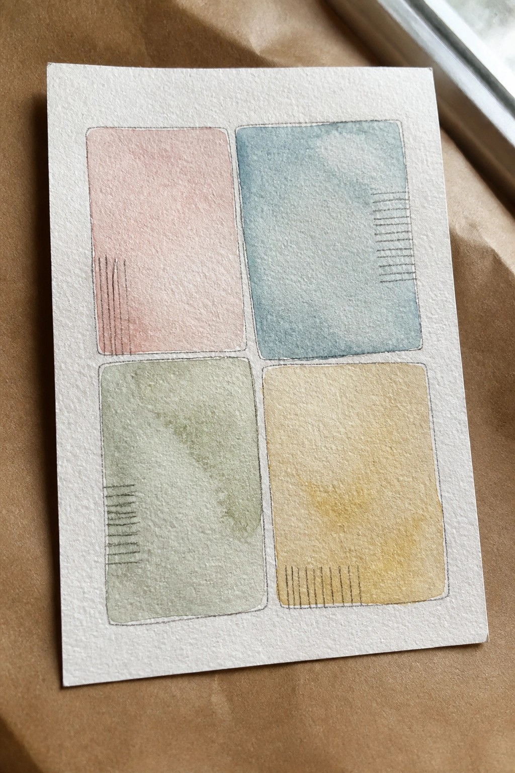 Pastel watercolor painting with four colored rectangles and black line details.