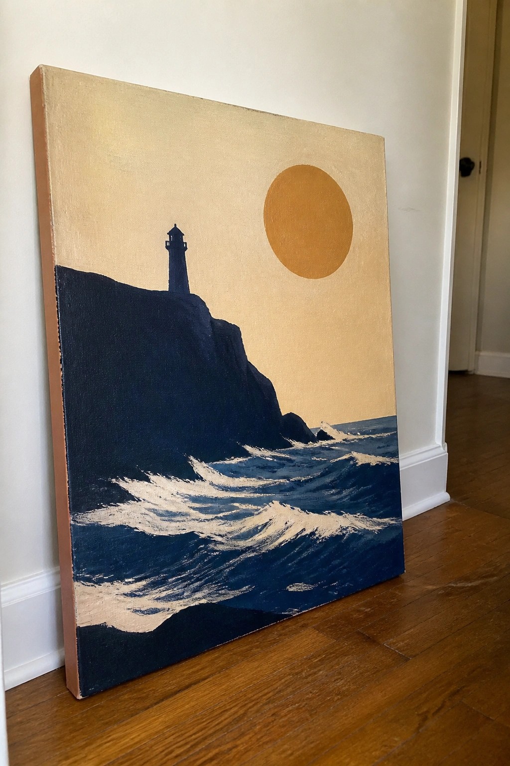 Painting of lighthouse on dark cliff above crashing blue waves with large orange sun