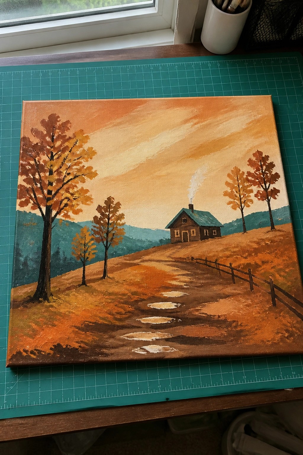 Autumn landscape painting with cabin, orange trees, stone path, and wooden fence.