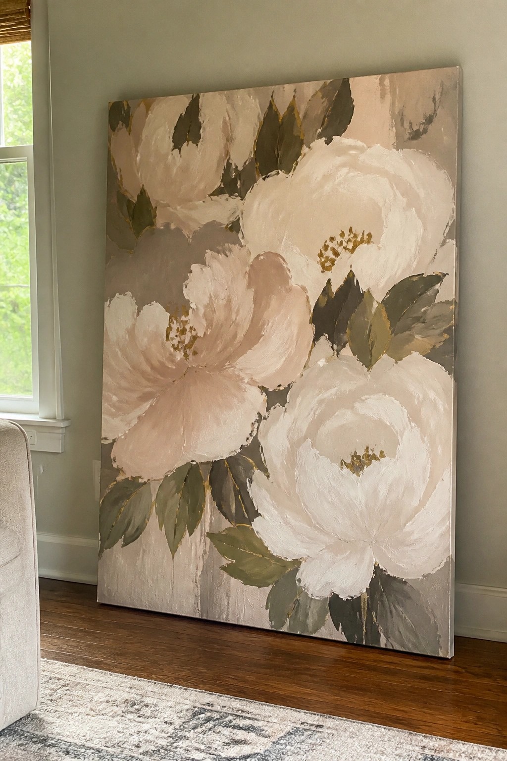 Large floral painting of white peonies with green leaves and gold accents on canvas