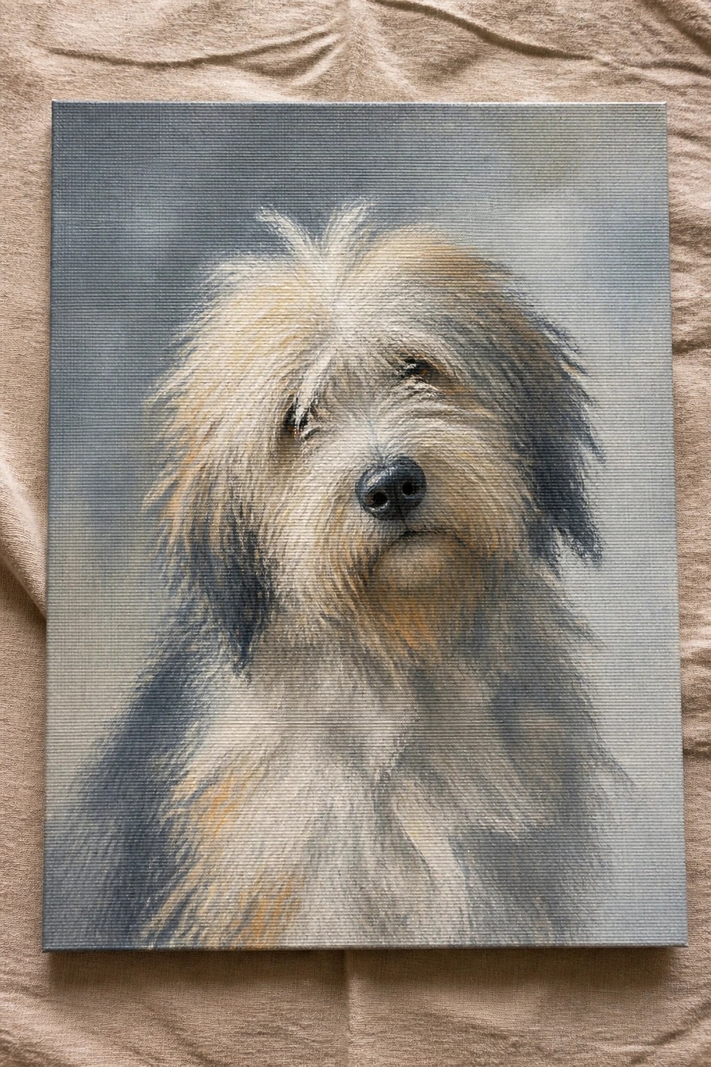 A realistic oil painting of a shaggy dog with white, beige, and gray fur on a gray canvas background.